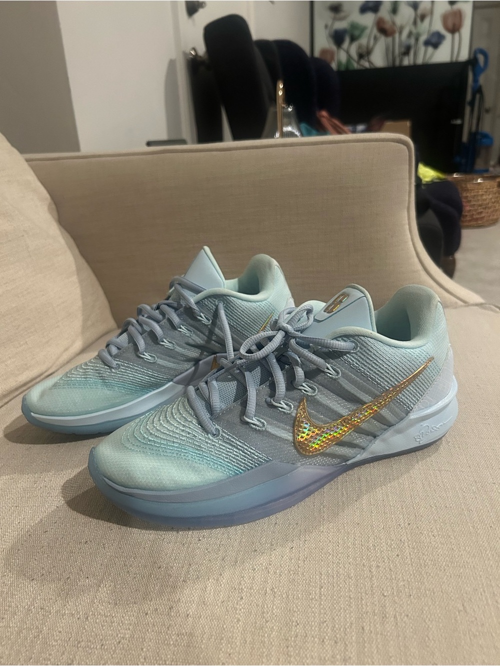 Nike Light Blue Sneakers with Holographic Gold Swoosh